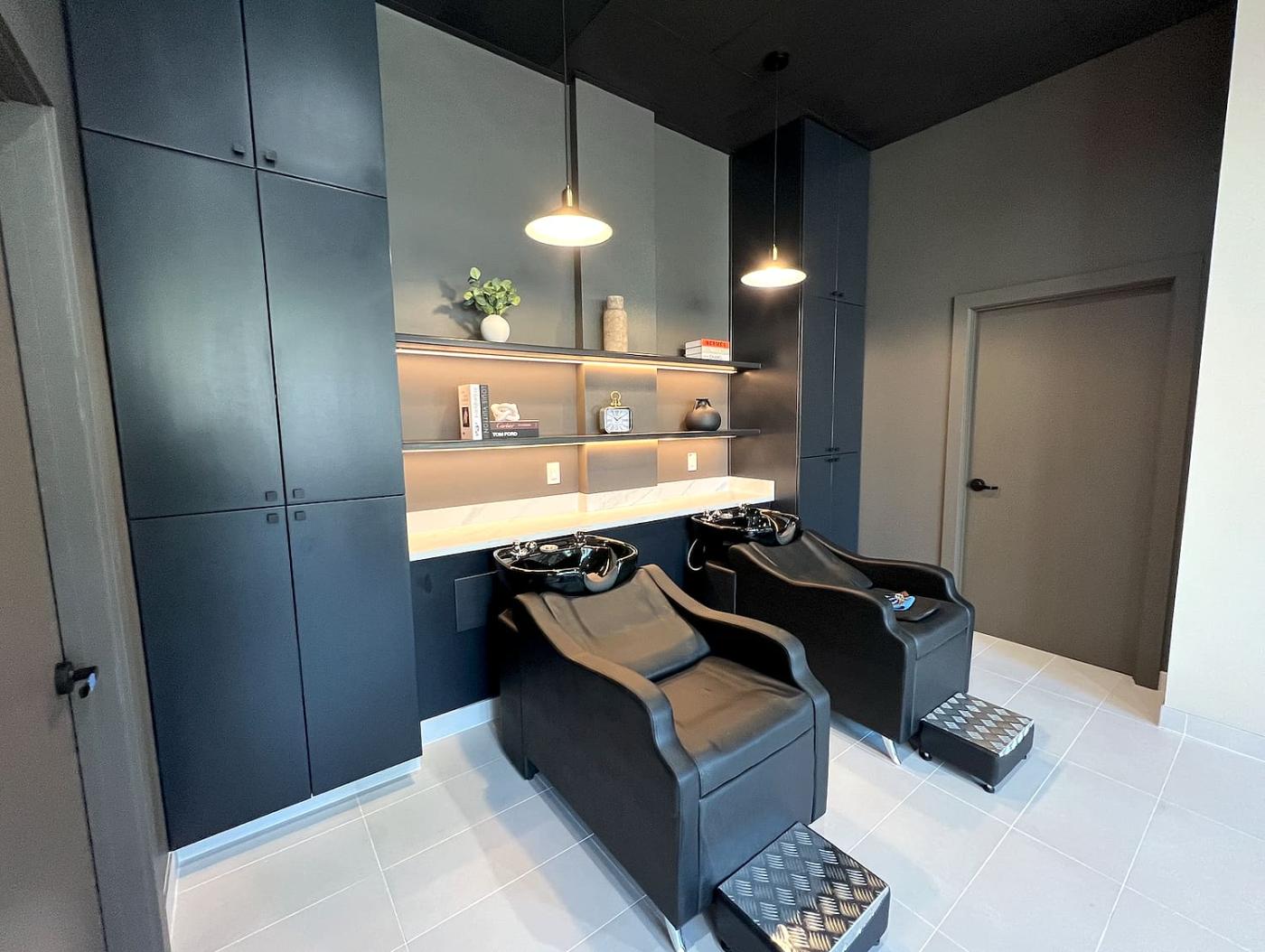 Two shampoo beds in the private wash room at Liana Hair Salon, Seattle