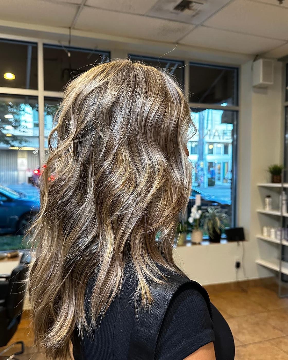 Long lived-in blonde highlights cut and styled at Liana Hair Salon in Seattle