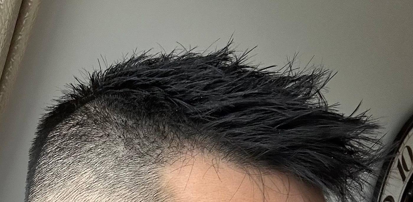 Close detail of a skin fade and textured top cut at Liana Hair Salon, Seattle